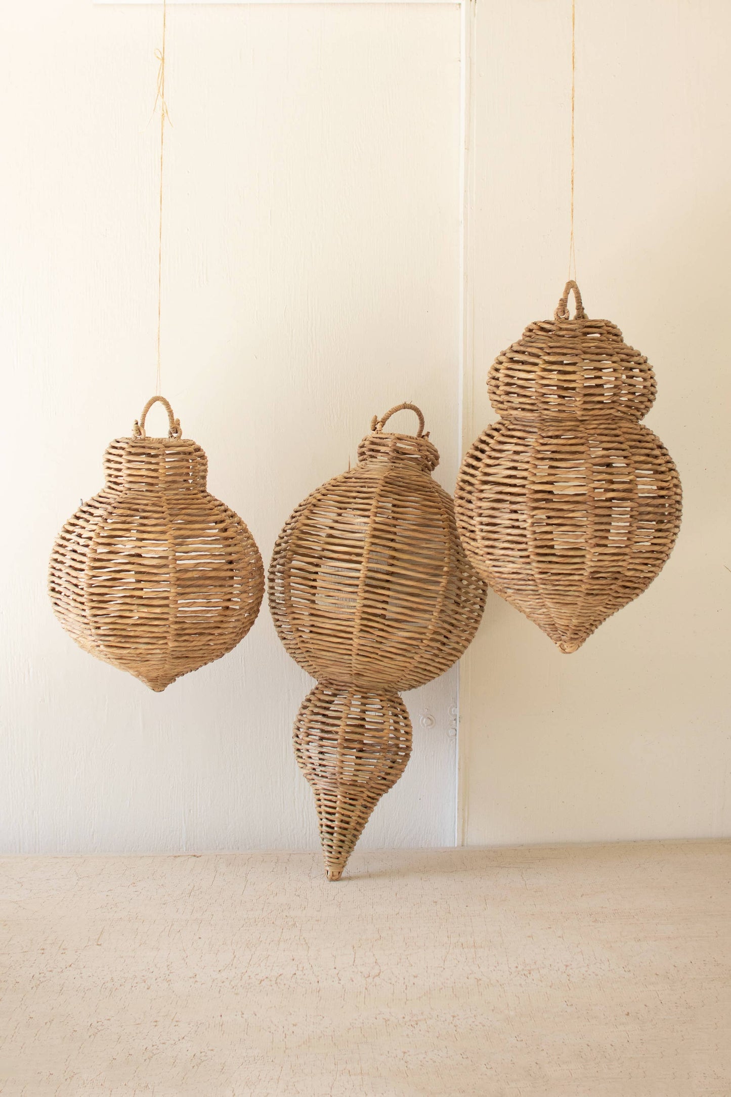 SET OF THREE LARGE WOVEN SEAGRASS AND IRON ORNAMENTS