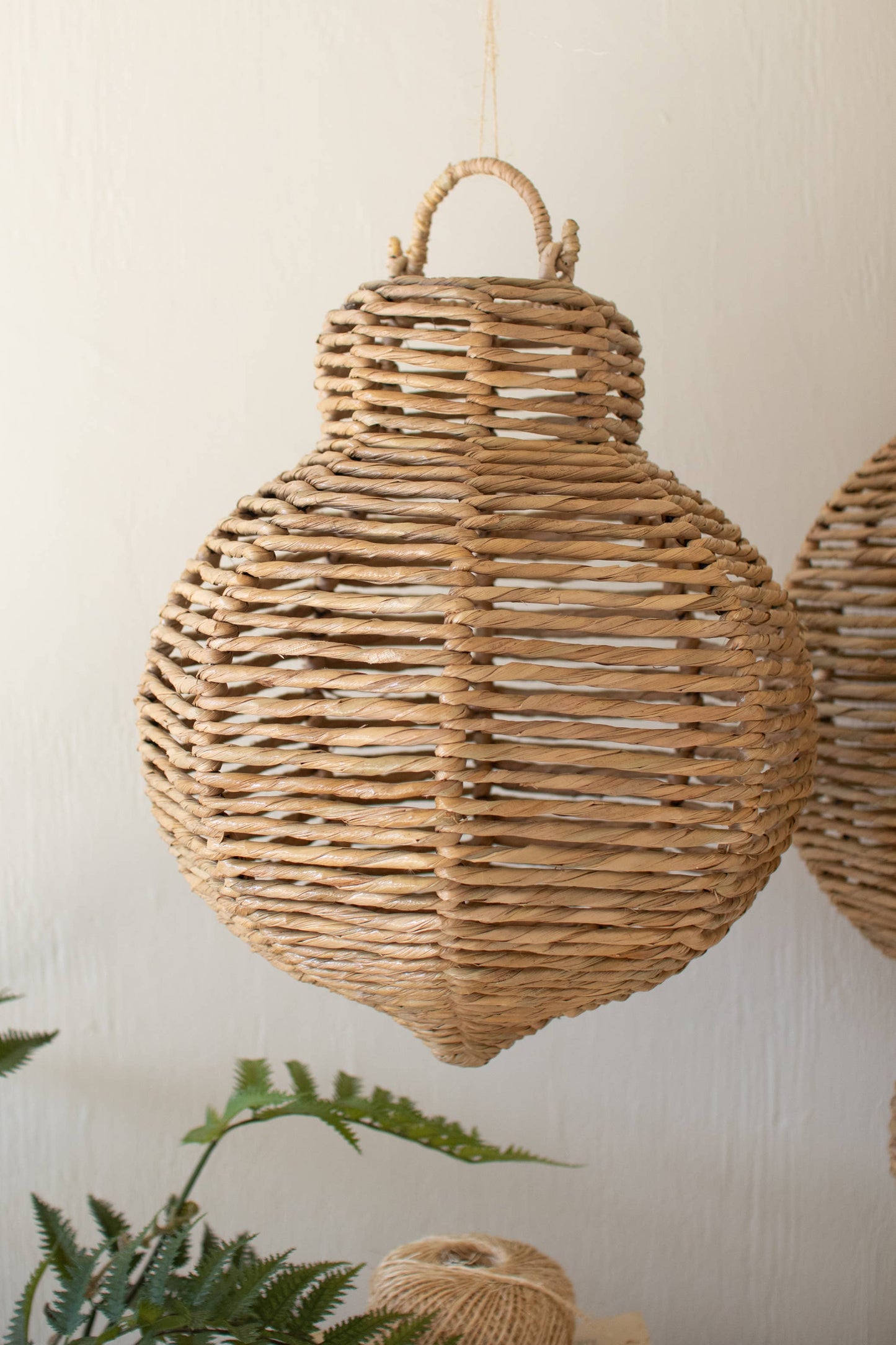 SET OF THREE LARGE WOVEN SEAGRASS AND IRON ORNAMENTS